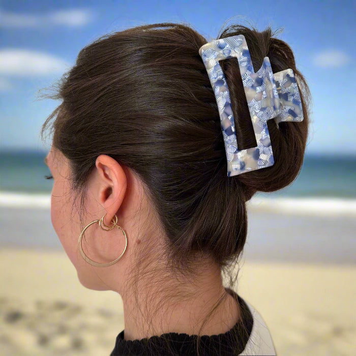 Model wearing a Indigo Bloom rectangular hair claw clip, shown from behind.