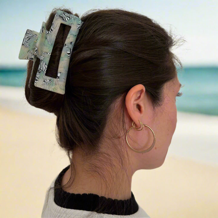 Model wearing a Zebra Haze rectangular hair claw clip, shown from the side.
