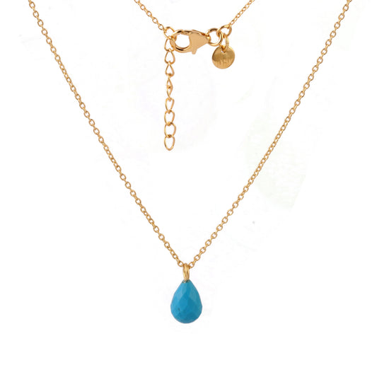 A delicate gold vermeil chain necklace featuring a small, teardrop-shaped turquoise blue stone pendant, displayed against a clean white background.