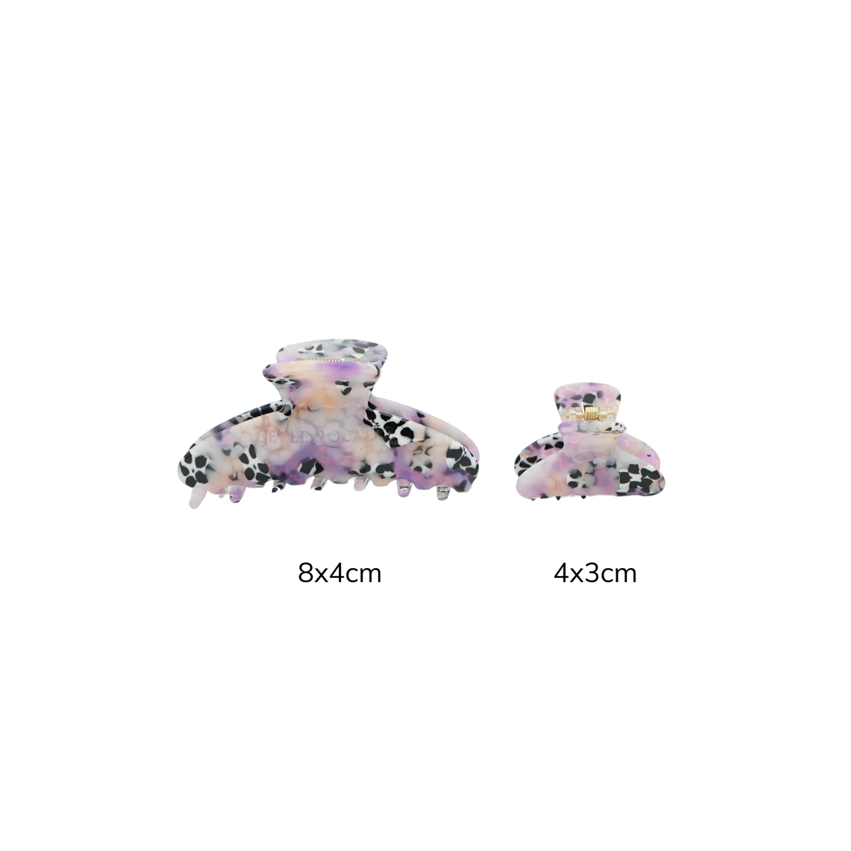 Two claw hair clips shown on a white background, one larger labeled 8x4cm and one smaller labeled 4x3cm. The clips have a translucent lavender-pink base with black speckled patterning.