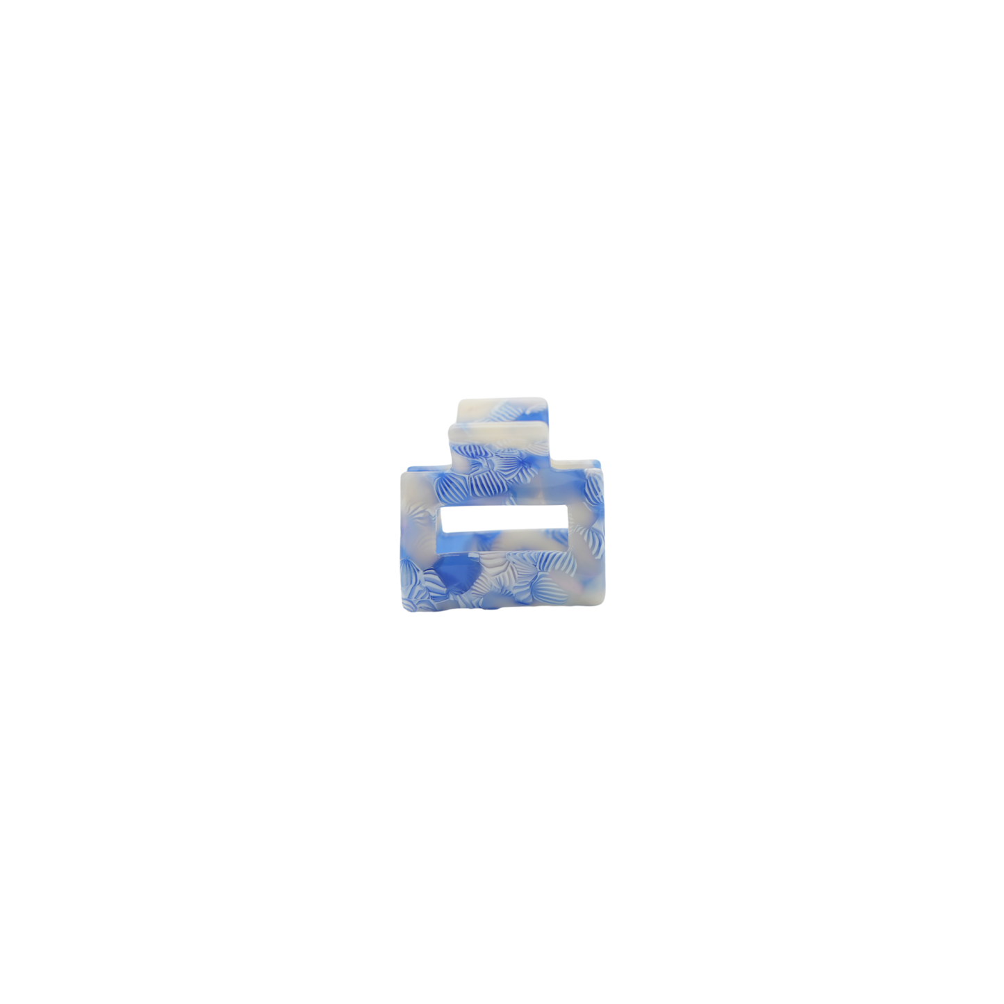 A small rectangular hair claw clip made from plant based cellulose acetate with a blue and white marbled pattern, centered on a plain white background.